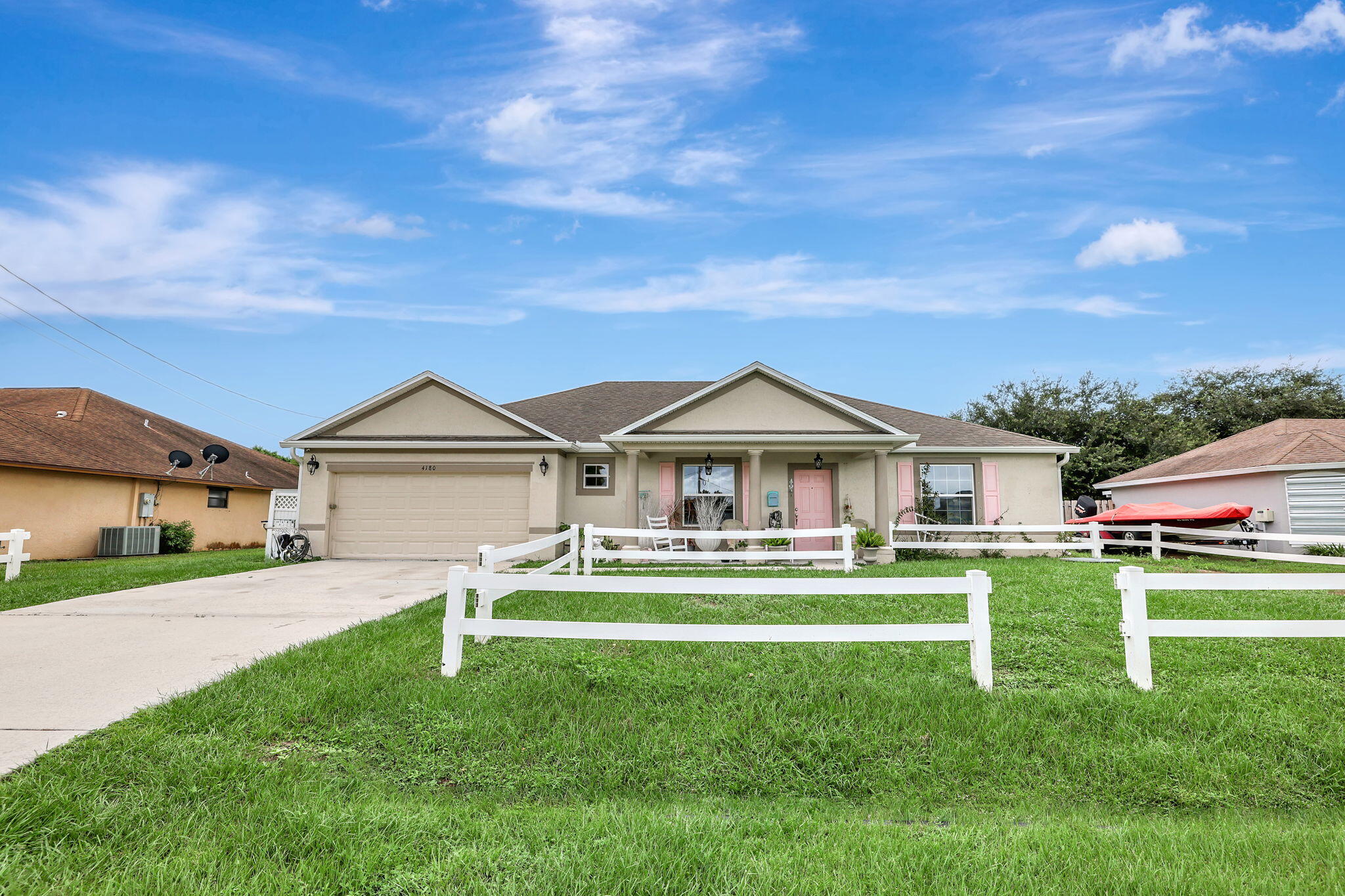 front view of a house with a yard