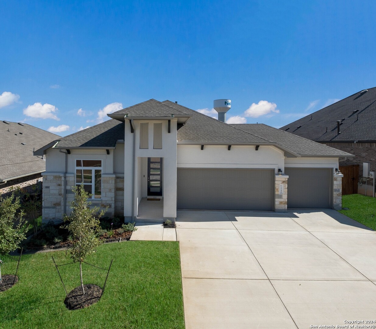 a front view of a house with a yard