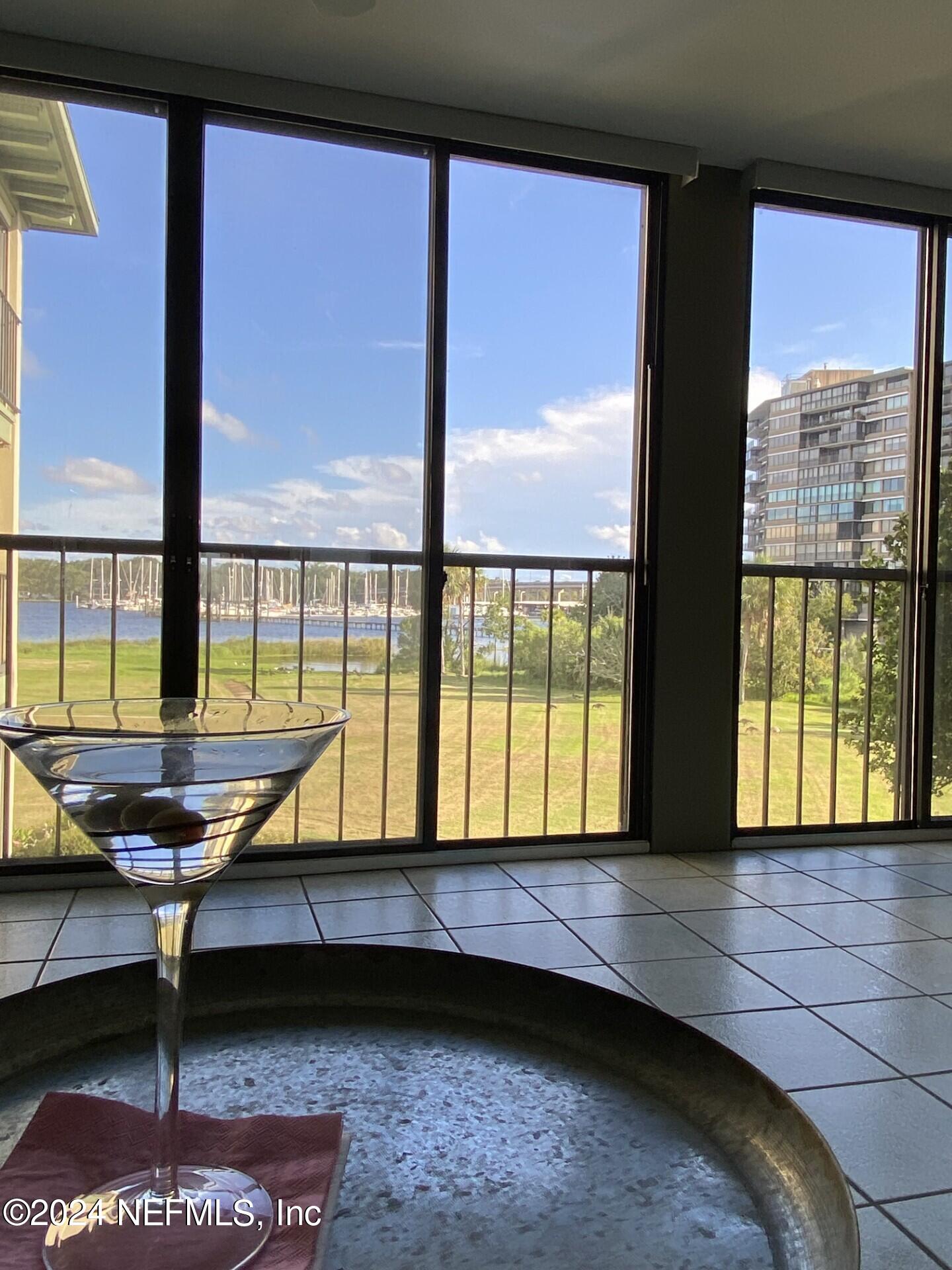 a view of a living room and floor to ceiling window