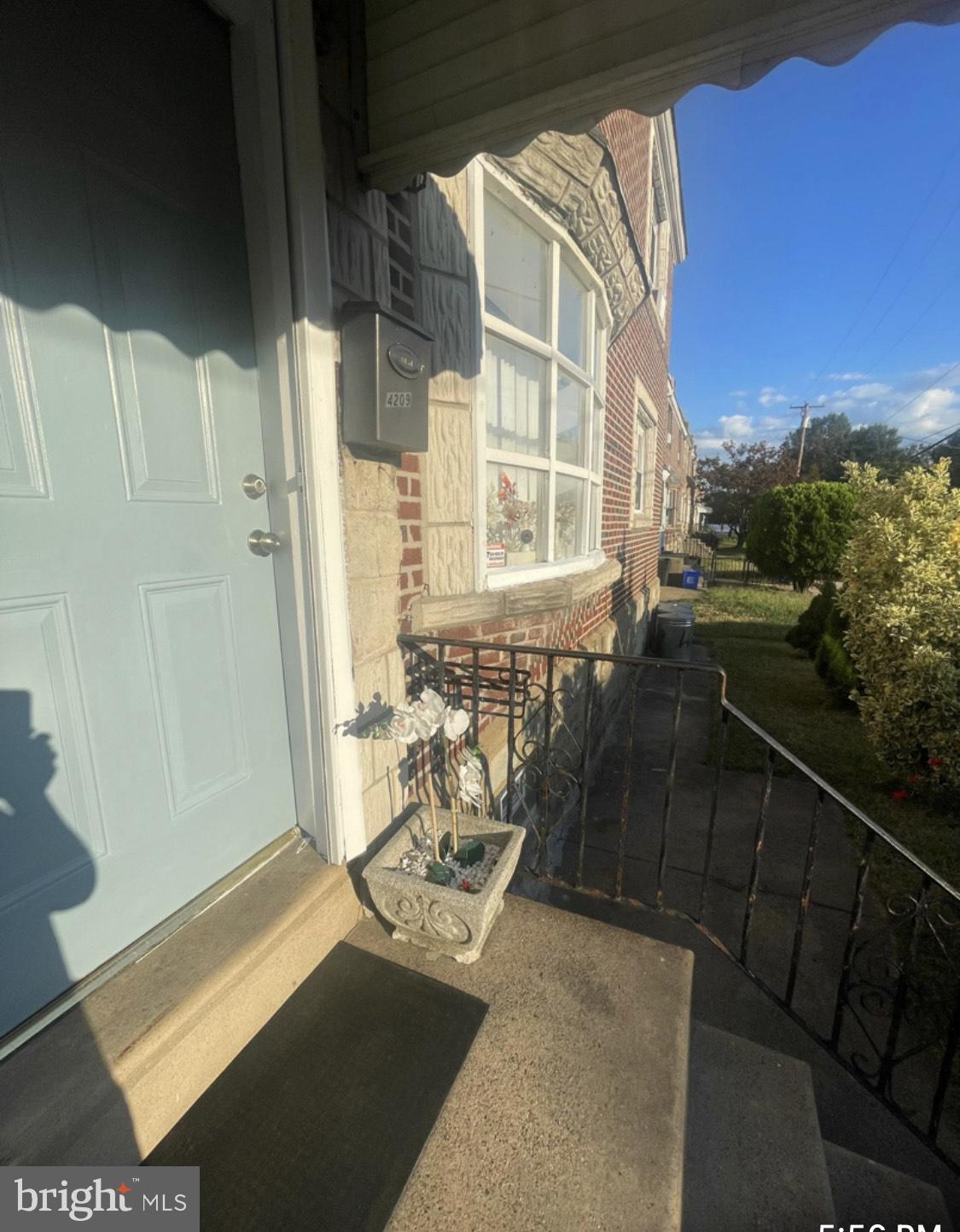 a view of balcony and a potted plant