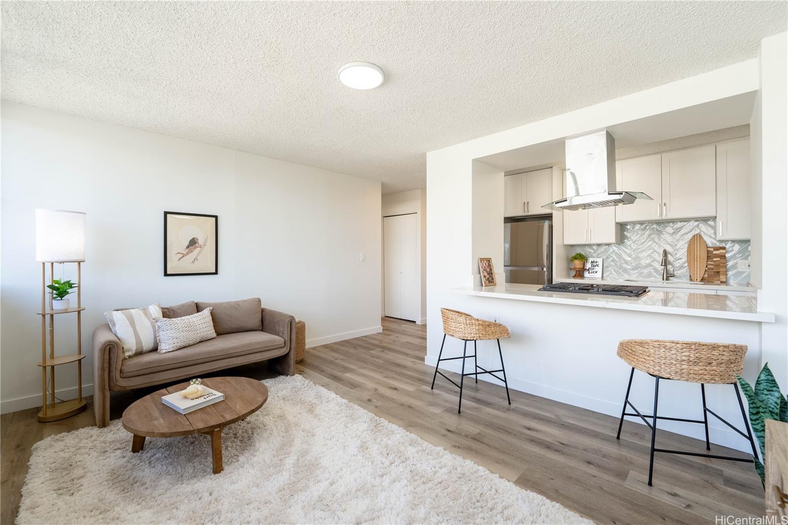 a living room with furniture and a rug