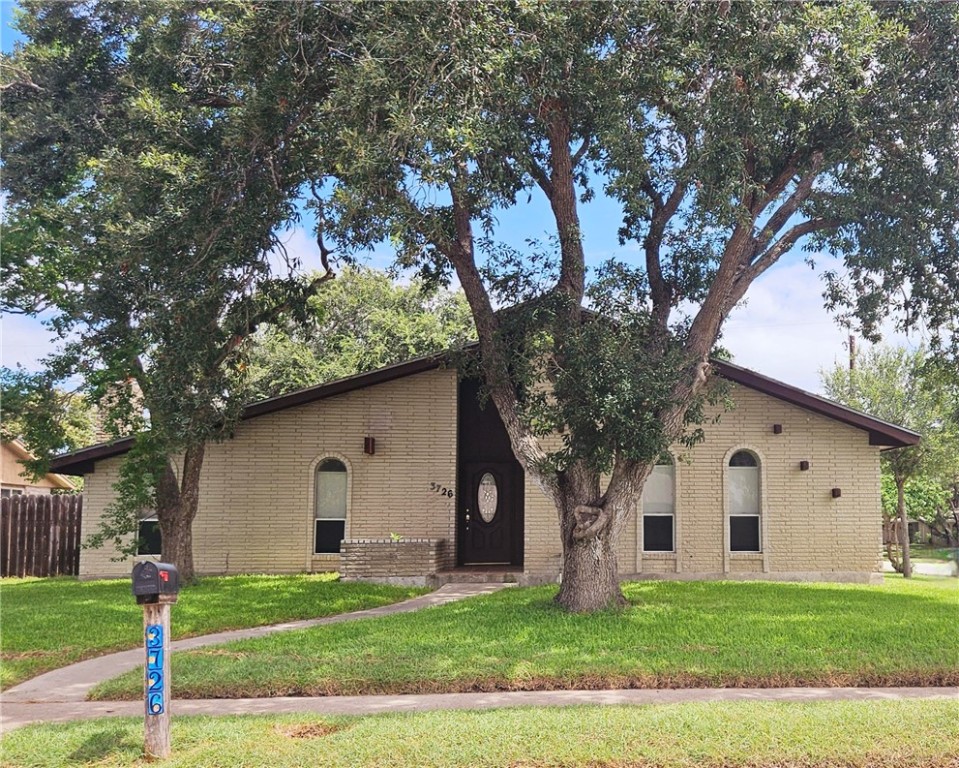 Great brick home on a corner lot with a side two c