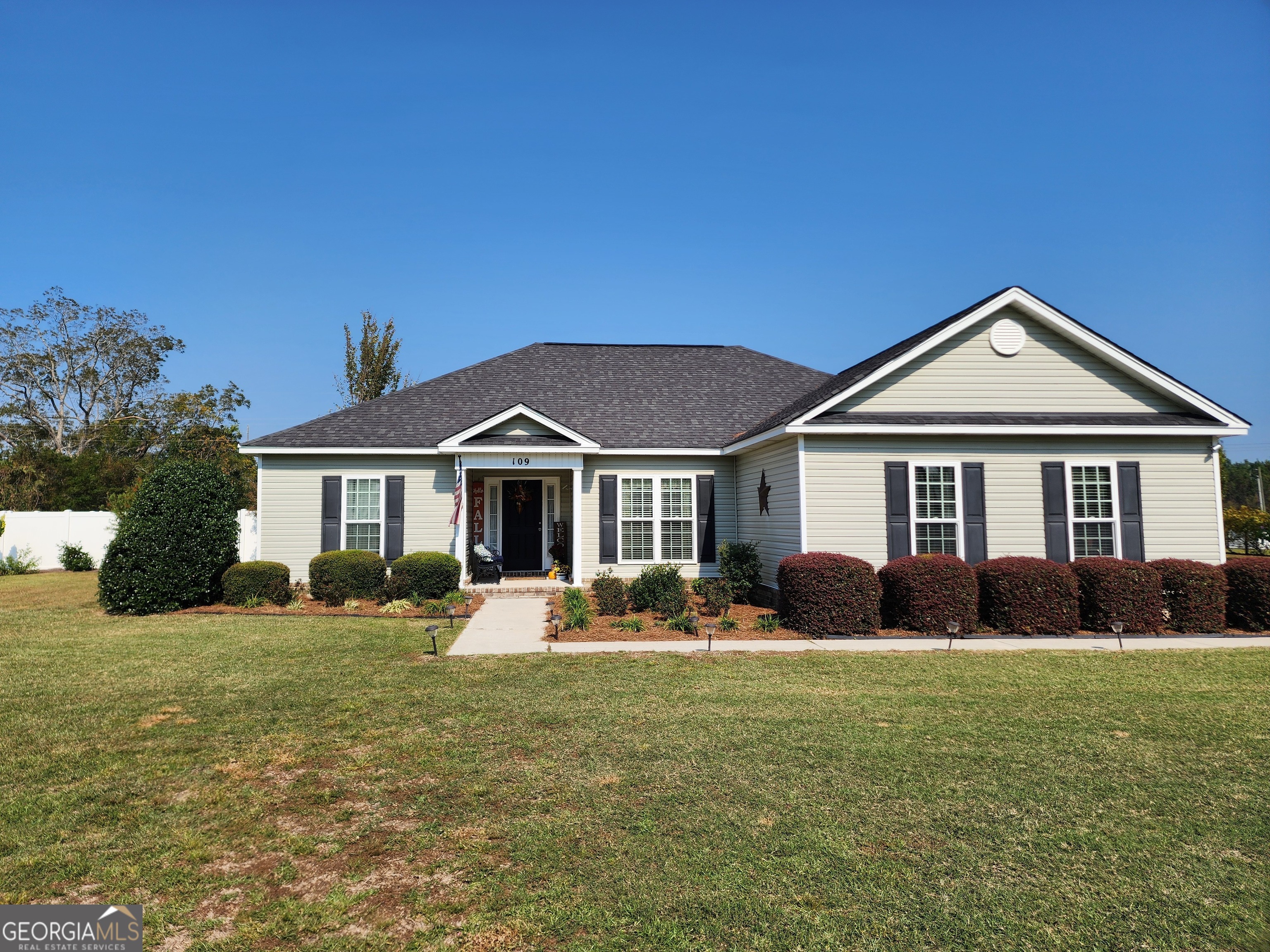 a front view of a house with a yard