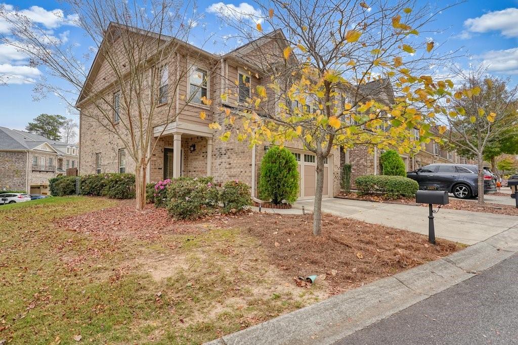 a front view of a house with a yard