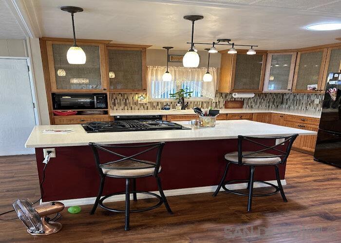 a kitchen with a dining table and chairs