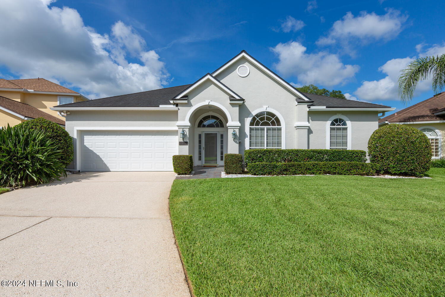 a front view of a house with a yard