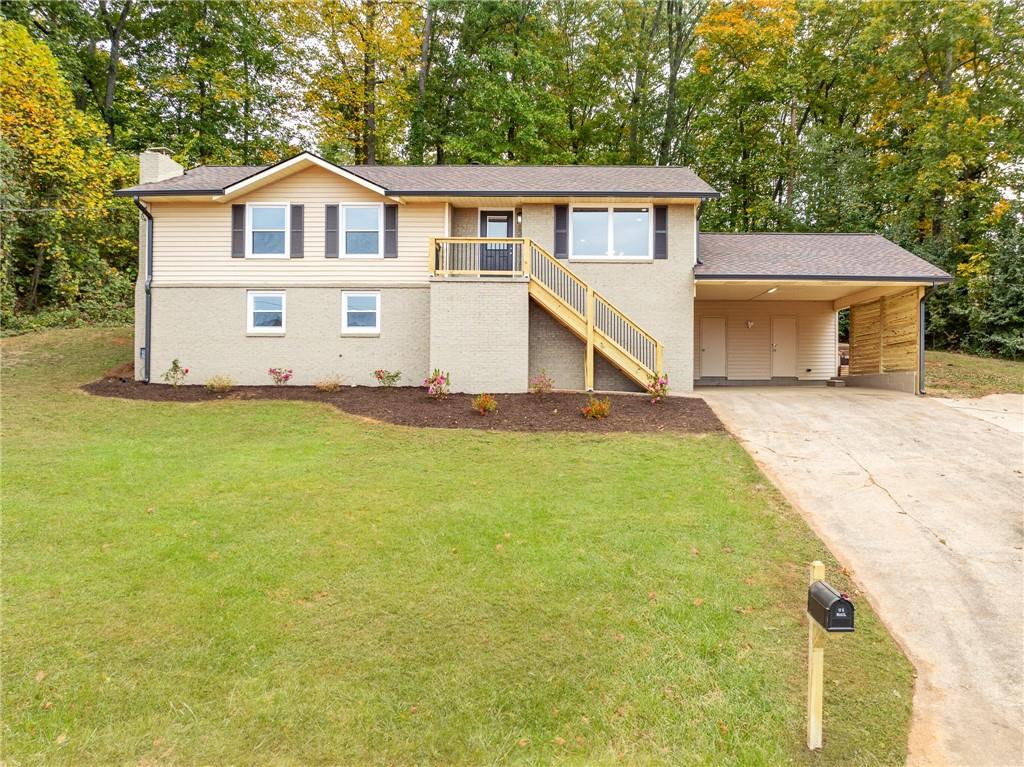 a front view of a house with a yard