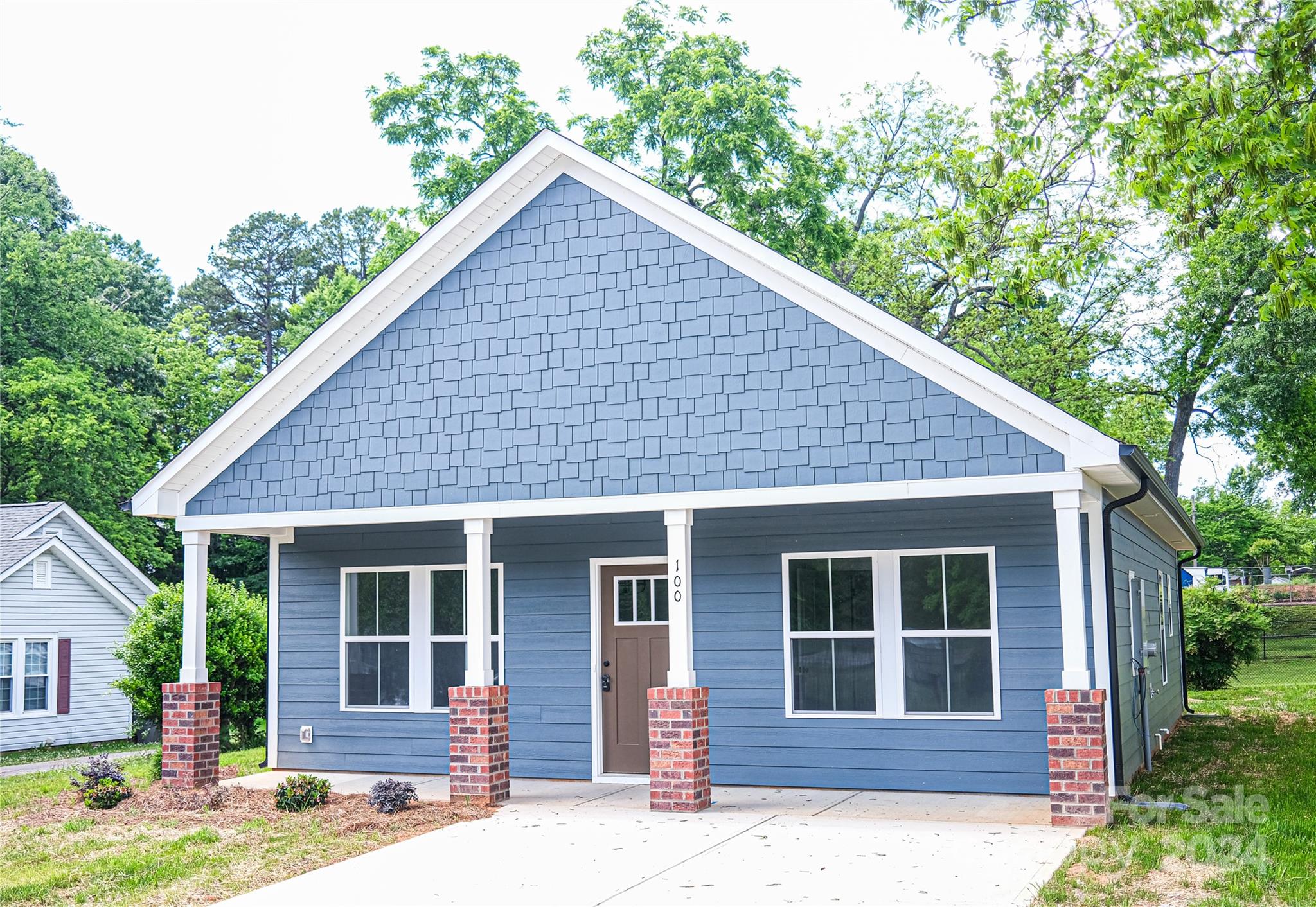 a house with trees in the background