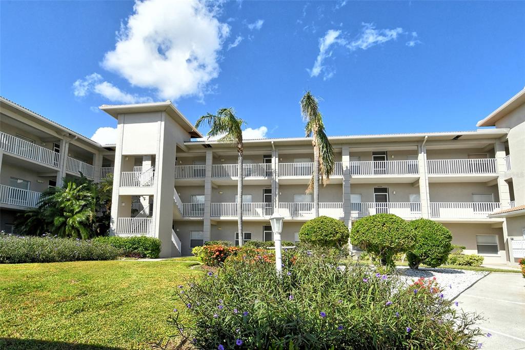 a view of a building with a yard