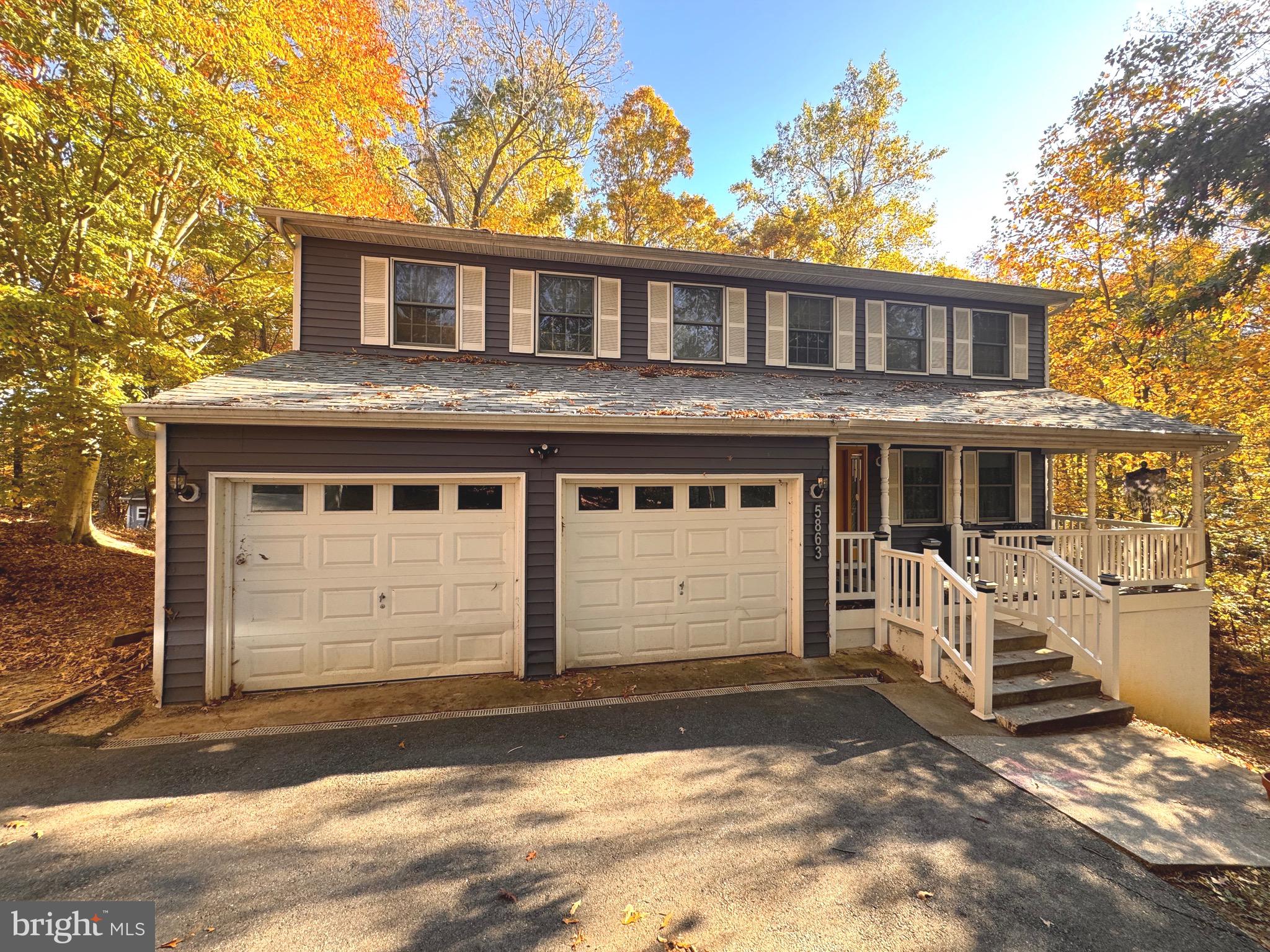 a front view of a house with a garage