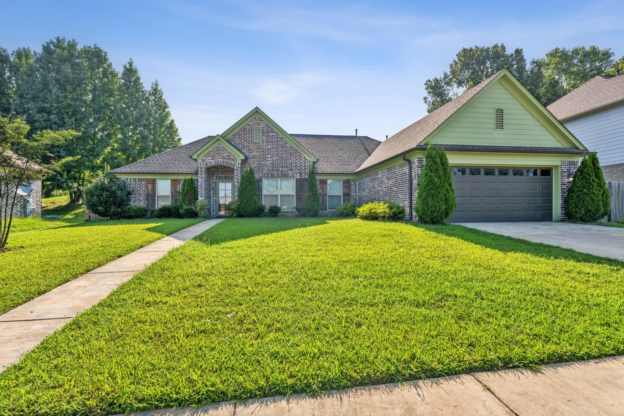 a front view of a house with yard