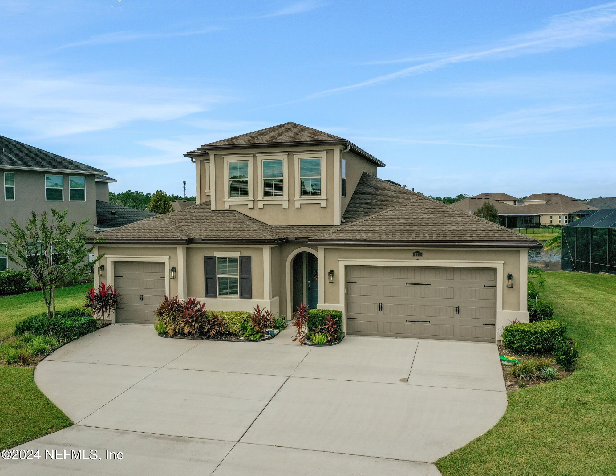 front view of a house with a garden