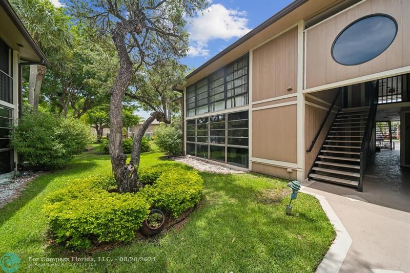 a backyard of a house with lots of green space