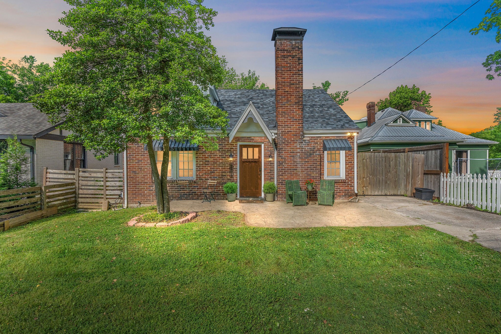 a front view of a house with a yard and porch