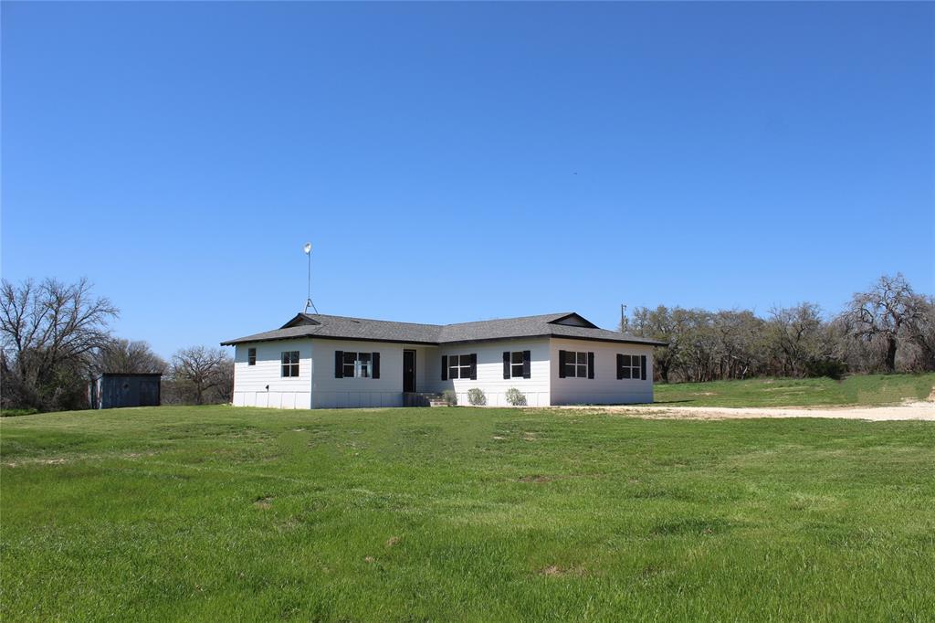 View of front of property with a front yard