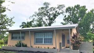 a house with a tree in front of it