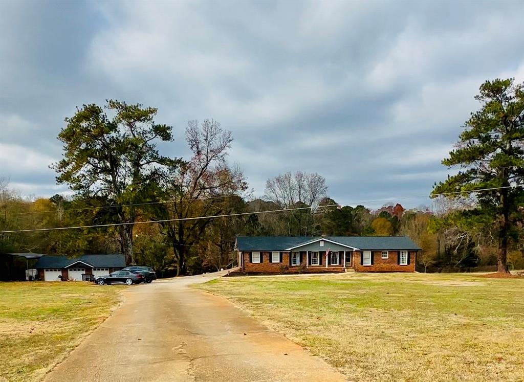 a view of house with outdoor space