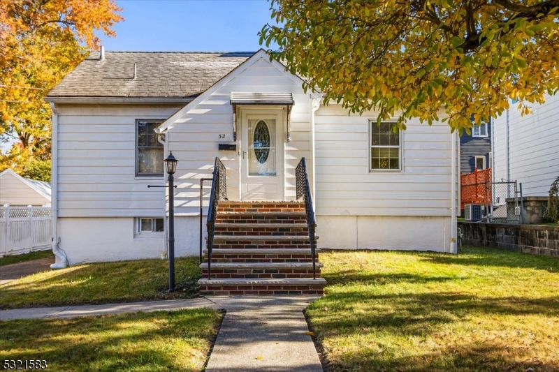 a view of house with backyard