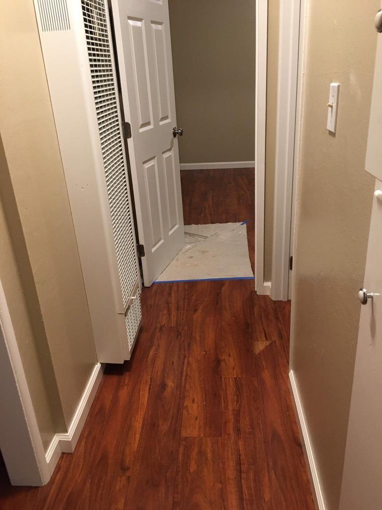 a view of wooden floor in an empty room