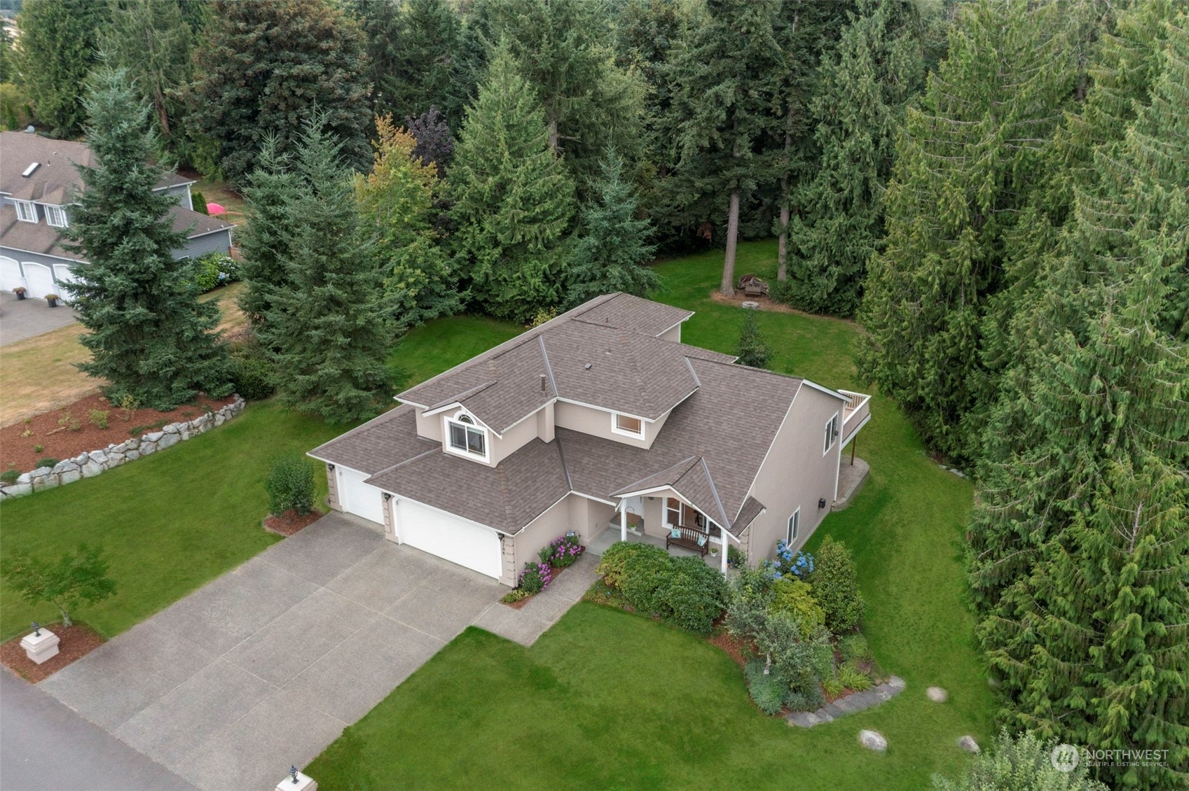 an aerial view of a house with a garden