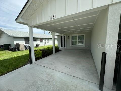 a view of a porch and garden