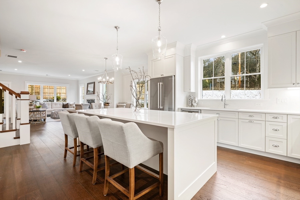 a large kitchen with granite countertop lots of counter space and window