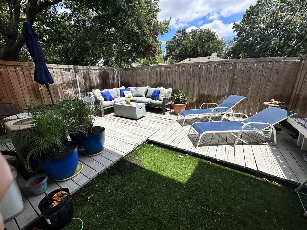 a view of a patio with furniture