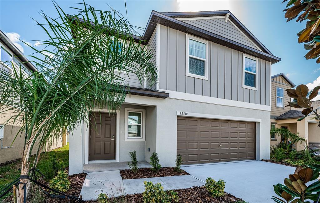 a front view of a house with a garage