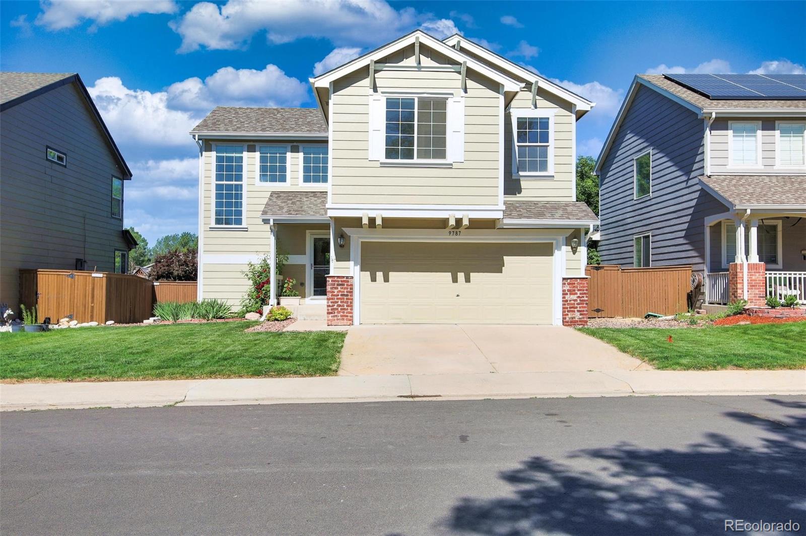 front view of a house with a yard