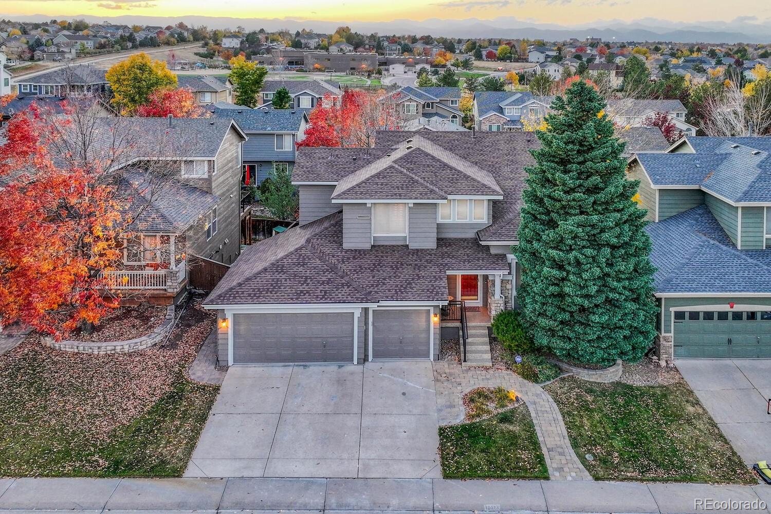 an aerial view of a house with a yard basket ball court and outdoor seating