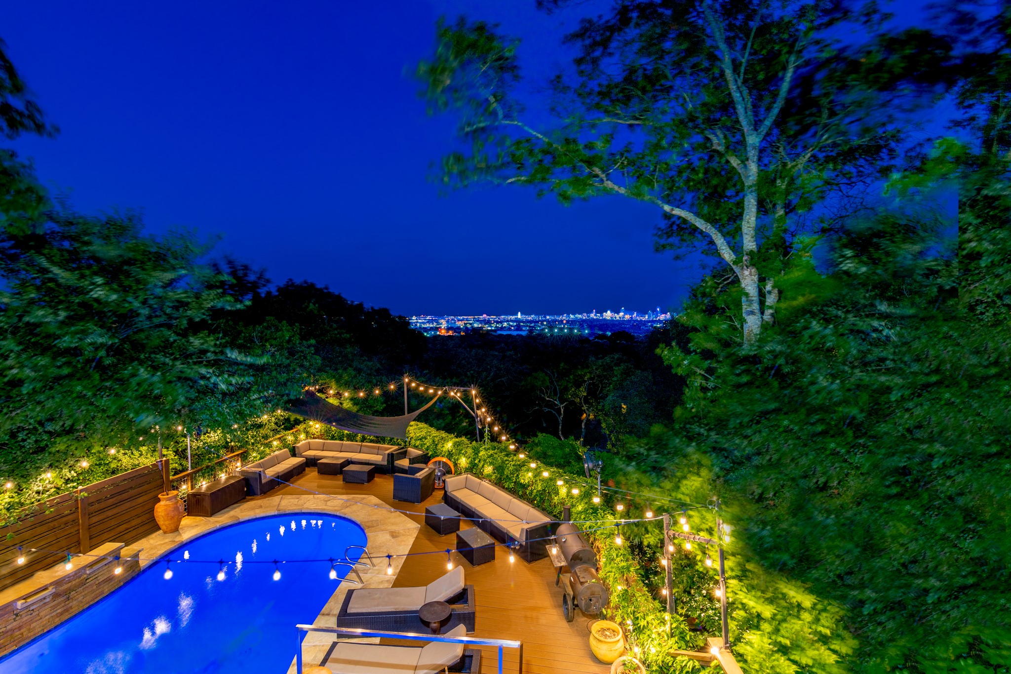 a view of swimming pool outdoor seating and yard