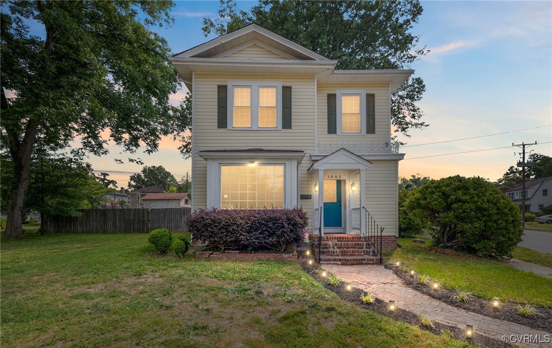 a front view of a house with garden