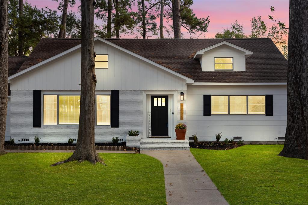 Welcome home to this Charming 1963 home with a modern façade and lush landscaping. With Tall mature trees and a quiet neighborhood, this is one you will want to see!