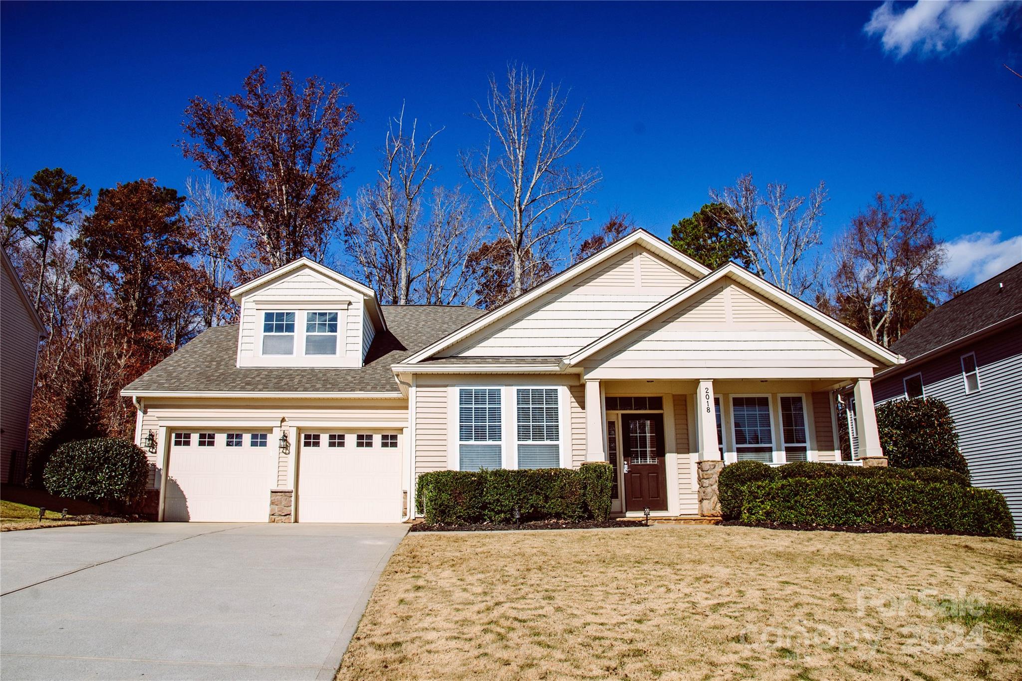 a front view of a house with a yard