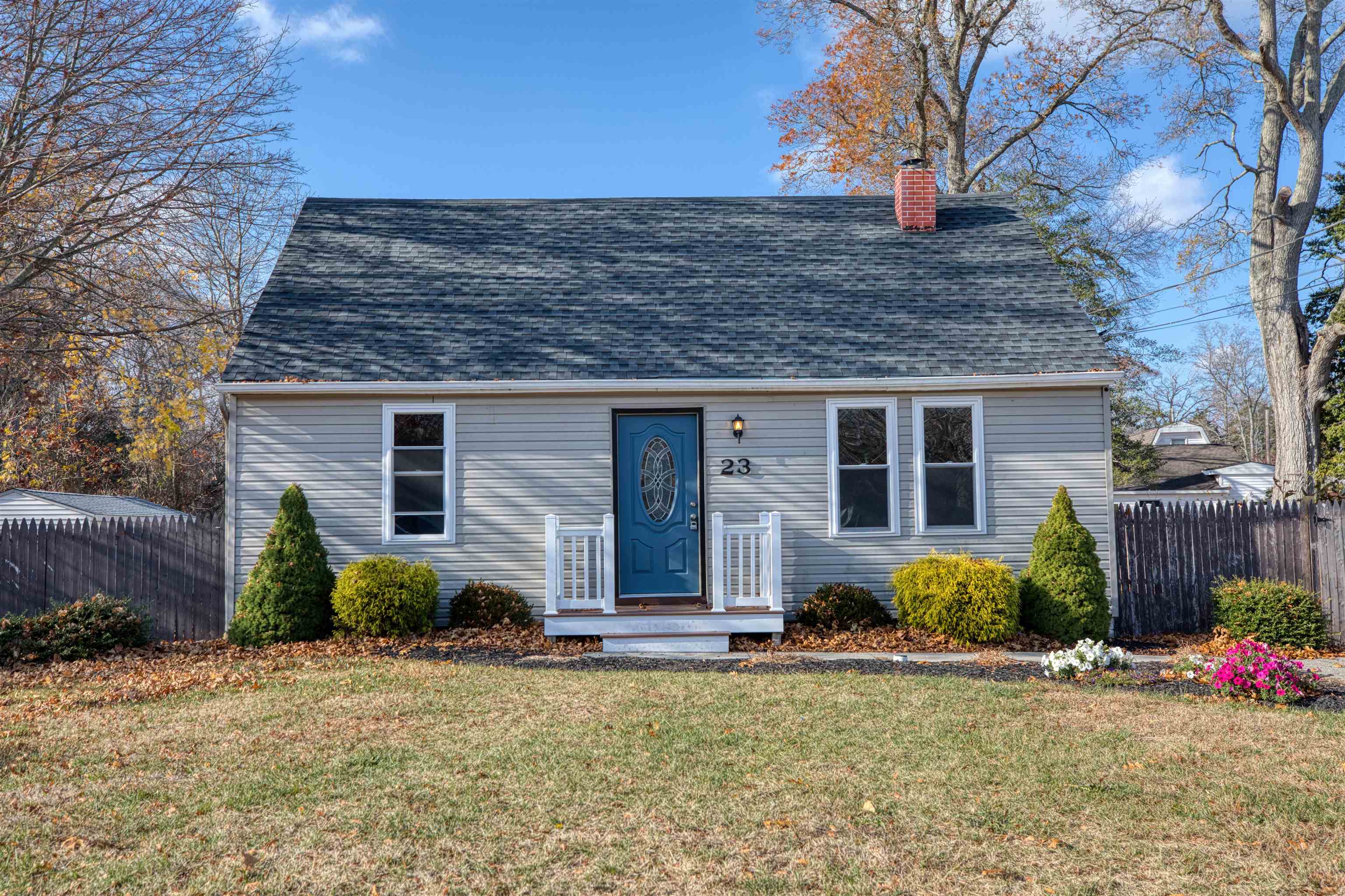 a front view of a house with garden