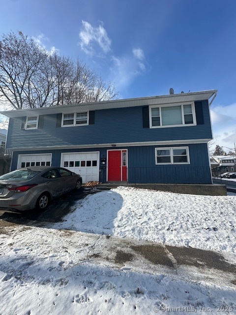 a front view of a house with parking space