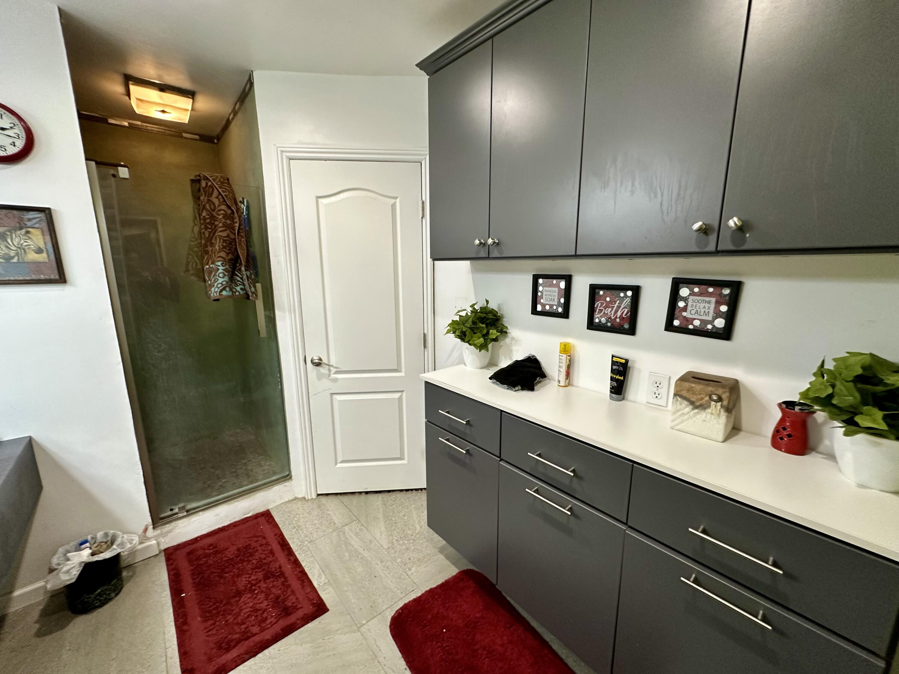 a kitchen with stainless steel appliances a refrigerator sink and cabinets