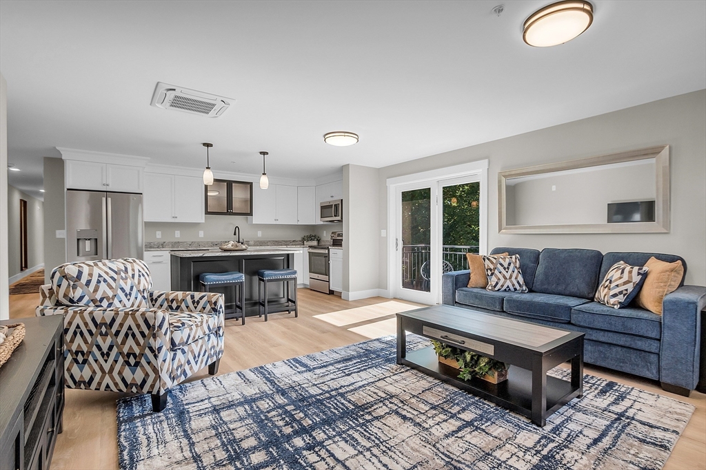 a living room with furniture and a table