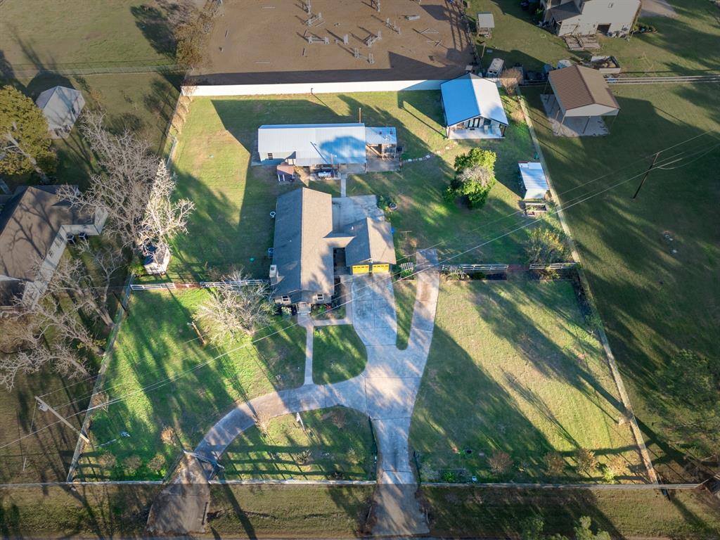 an aerial view of houses with outdoor space