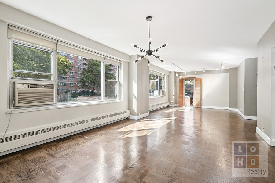 a view of an empty room with a window