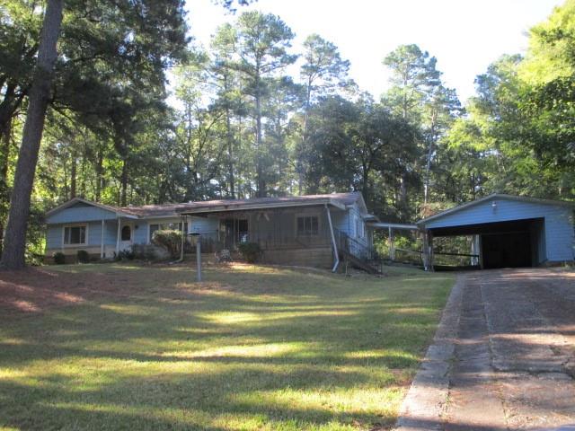 a view of a house with a yard balcony