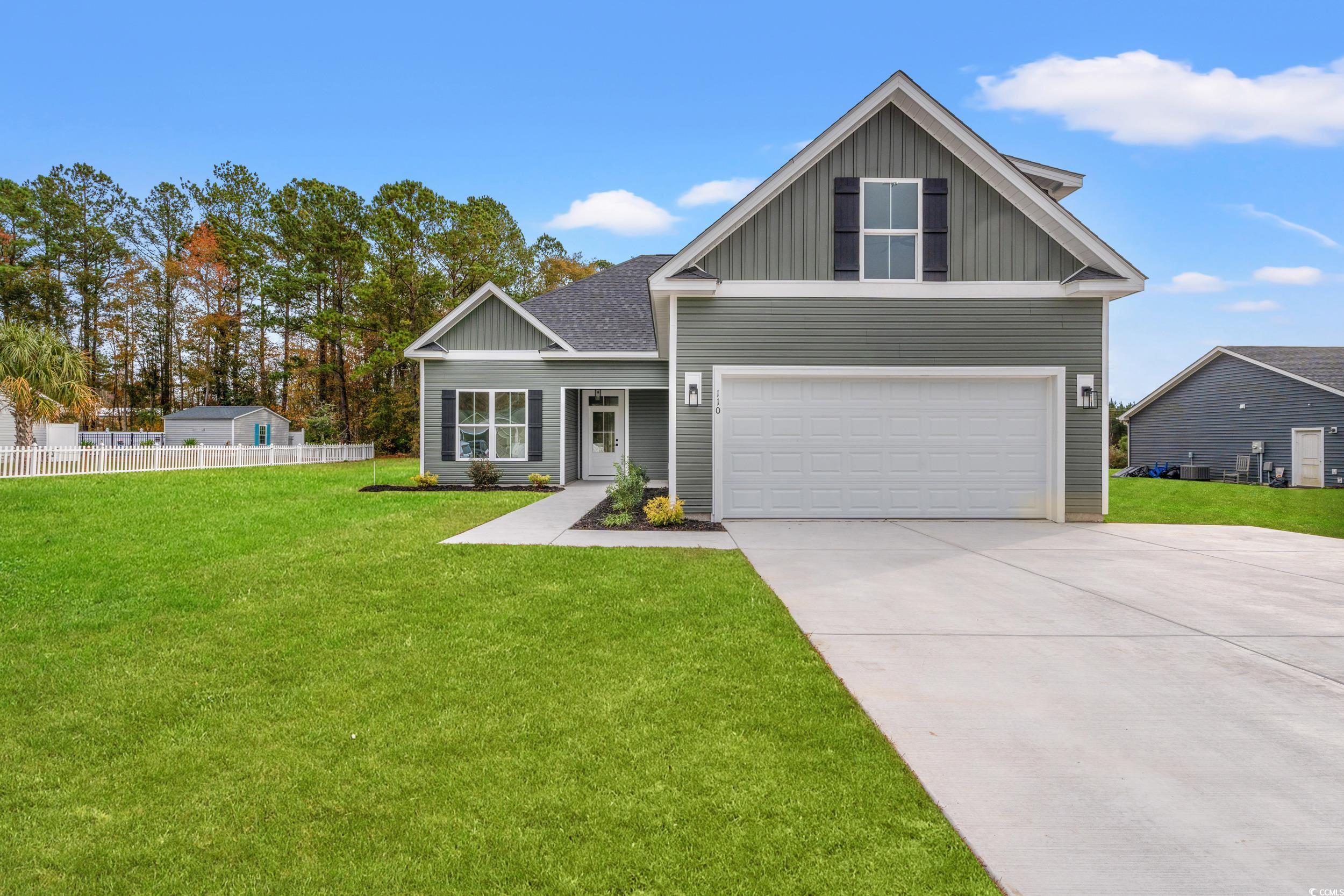 Craftsman inspired home featuring a front yard and