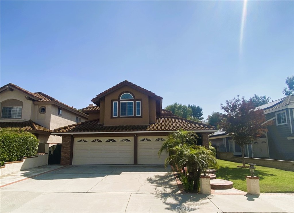 a front view of a house with yard