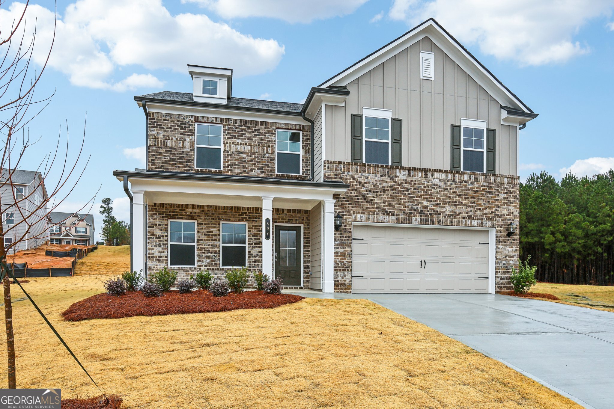 a front view of a house with a yard