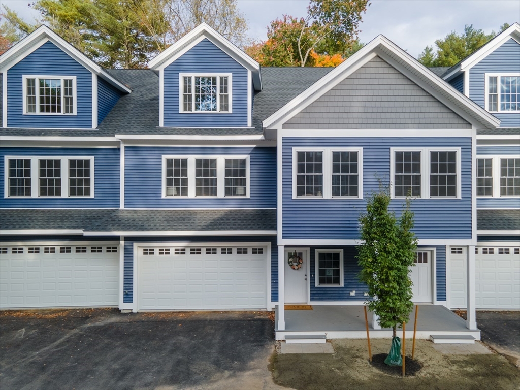 a front view of a house with yard