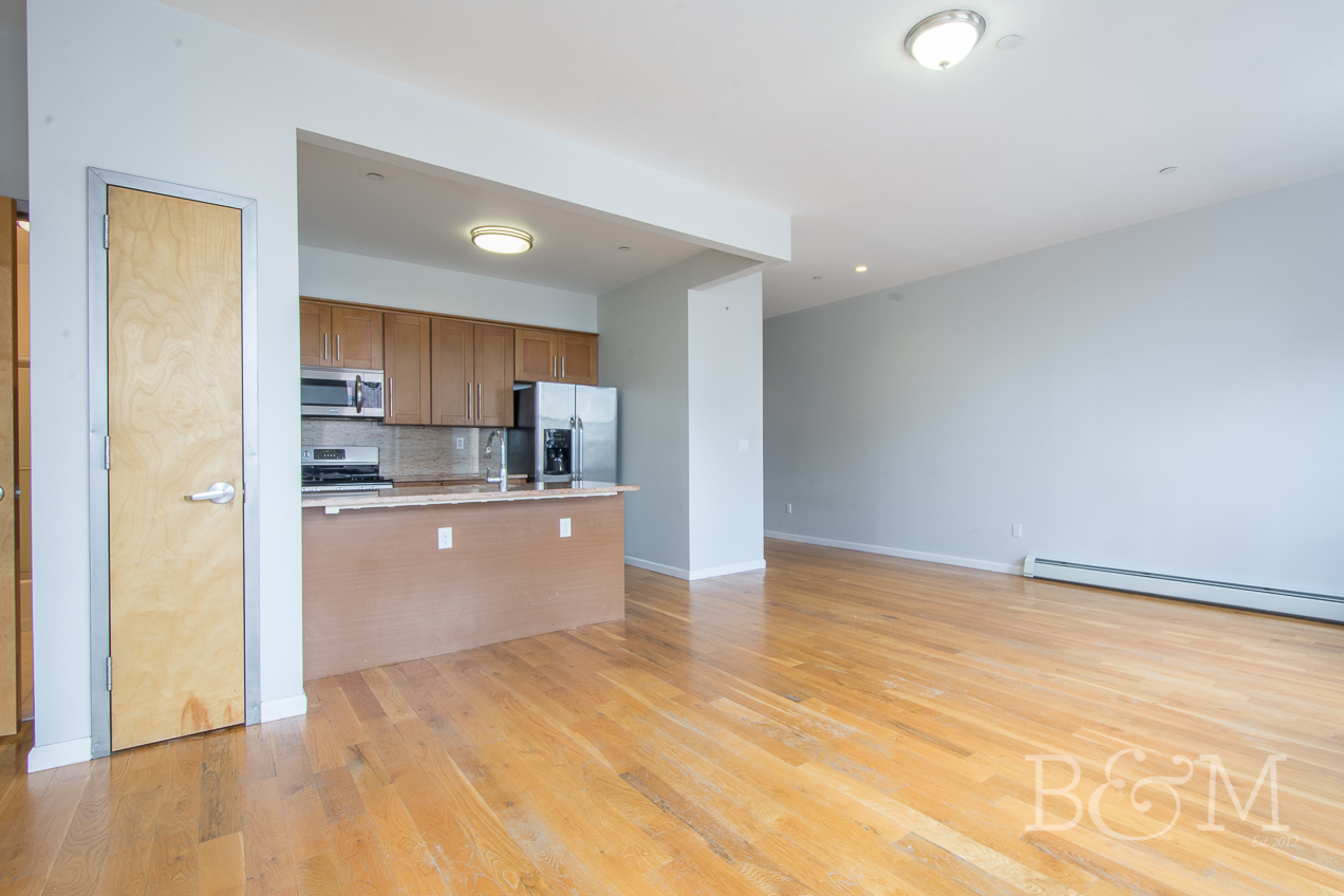 a view of kitchen with wooden floor