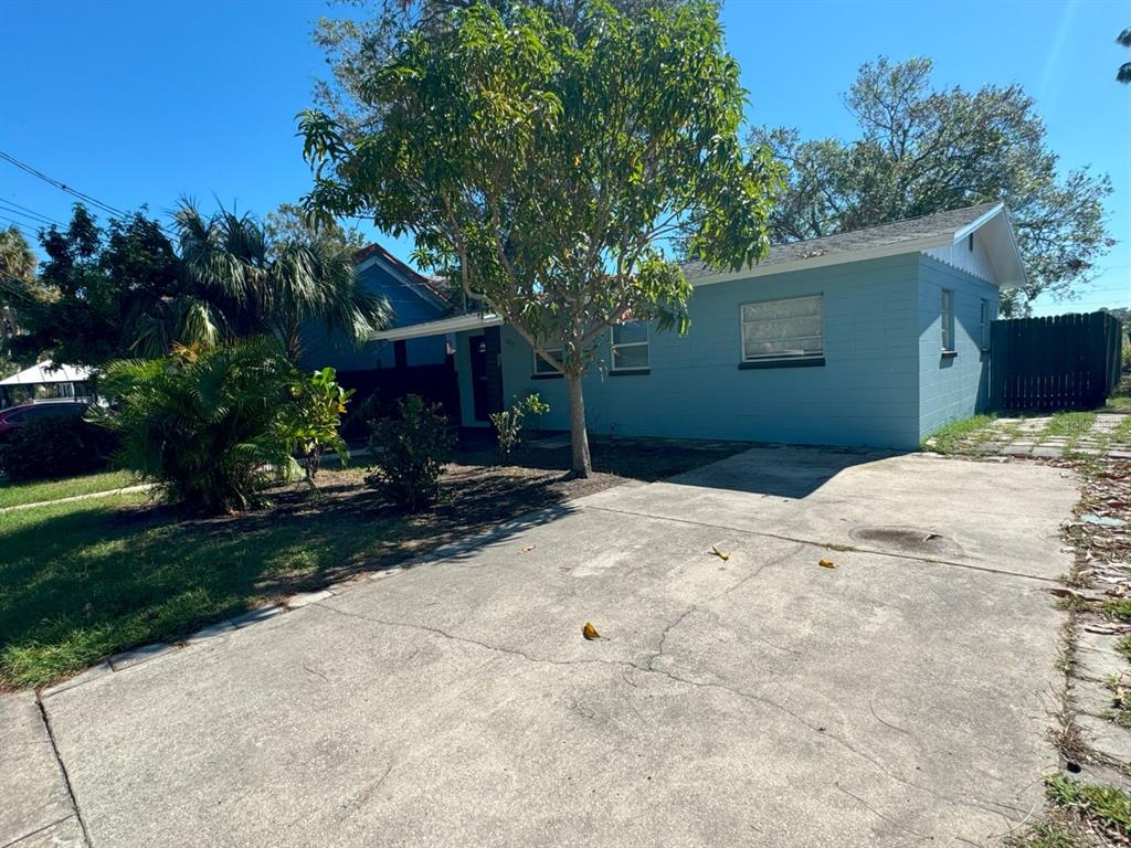 a front view of a house with a yard and a garage