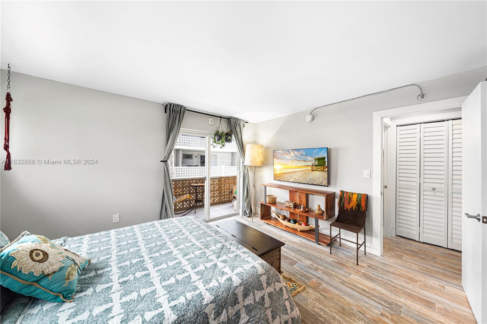 a bedroom with furniture and a window