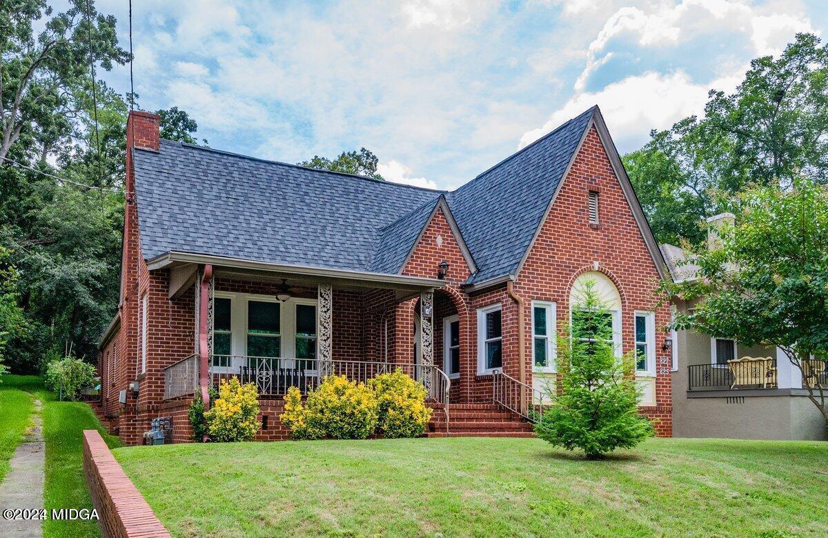 a front view of a house with garden