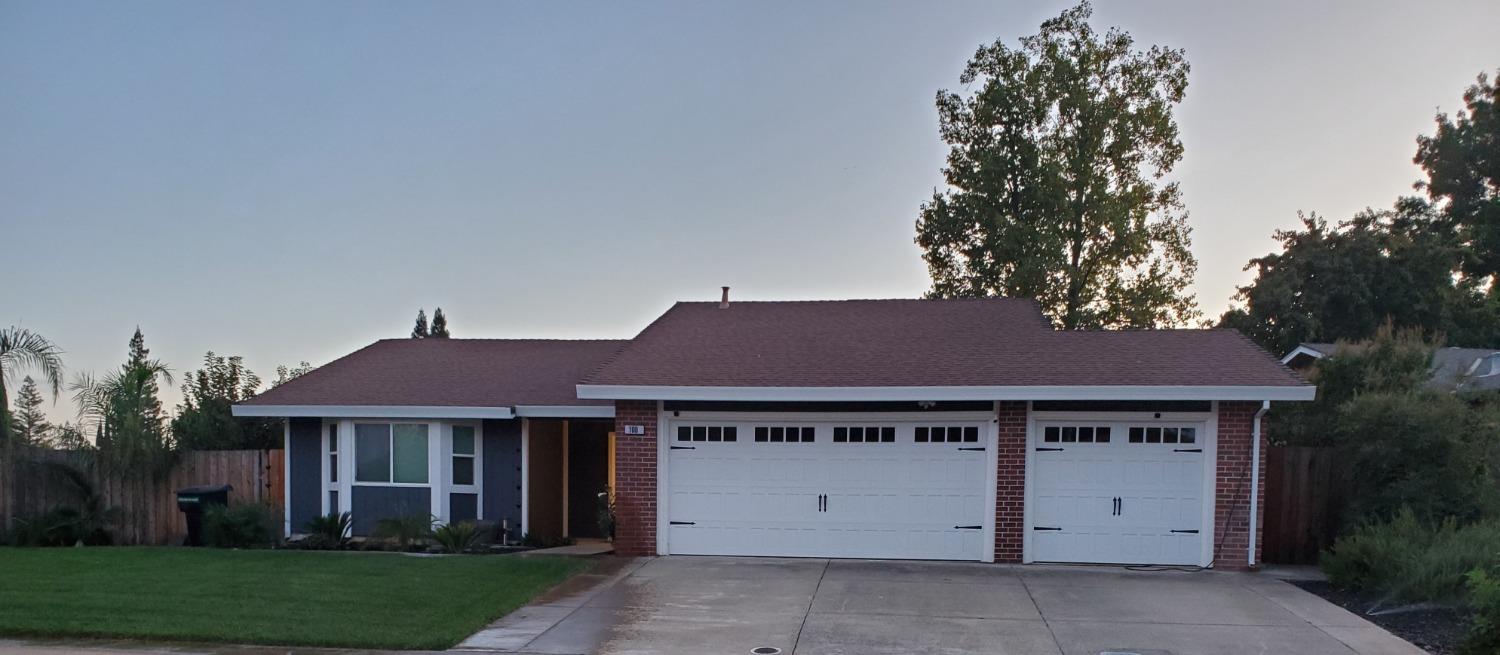 a house view with a garden space